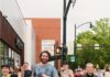 7 Walking and Running Clubs in Pittsburgh for Staying Active and Social A group of runners run through the streets of Pittsburgh.