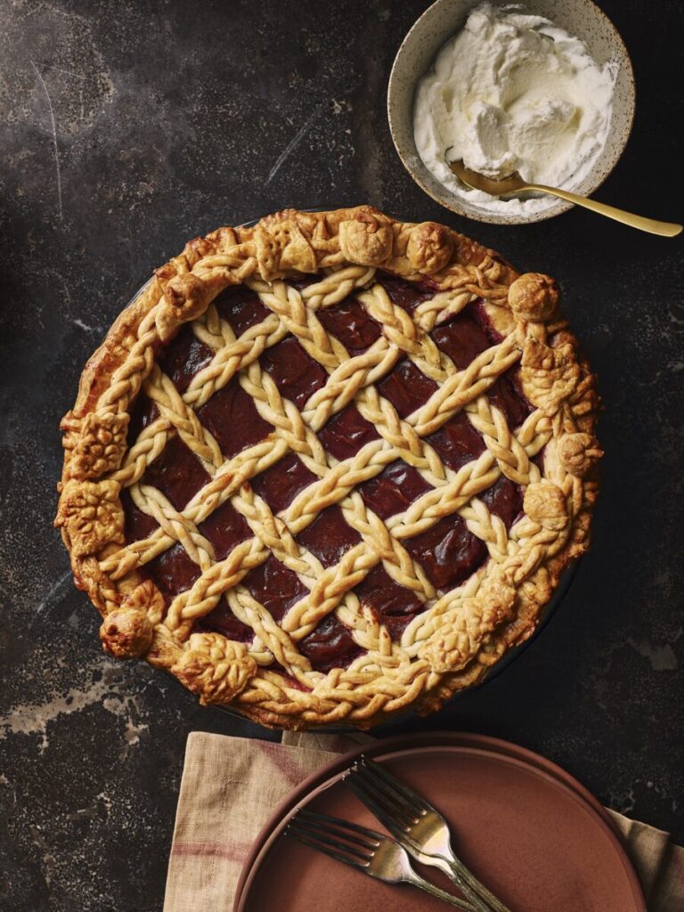 A pie with purple potatoes and bourbon honey with lattice work over top.