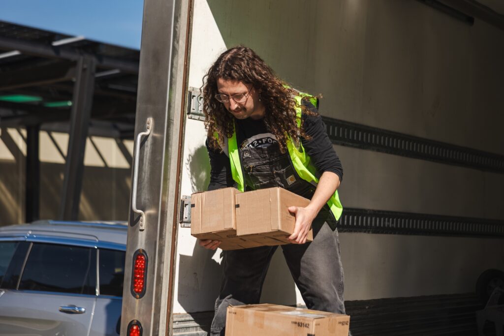 A man unloading boxes of rescued food for 412 Food Rescue.
