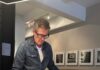 Photographer Blaise Hayward Examines American Unity Through 50 State Quarters Blaise Hayward looks through large prints of his state quarters series.