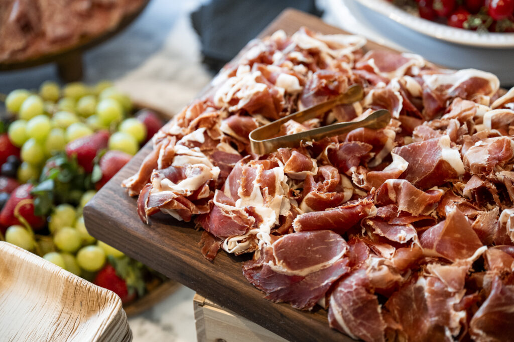 A tray full of charcuterie meat.