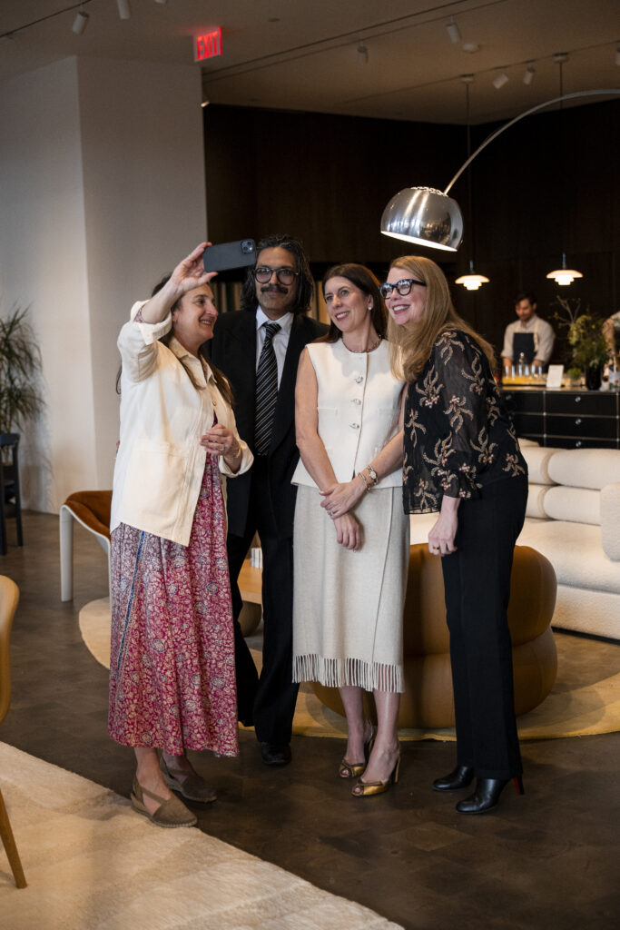 Four DWR employees take a selfie in the showroom space.