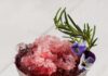 Pomegranate Mint Julep A pomegranate mint julep in a silver tin julep cup with crushed ice and a sprig of rosemary.