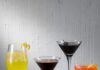 5 Stylish Cocktails Inspired by ‘The Devil Wears Prada 2’ Five cocktails for The Devil Wears Prada 2 sit on a white table in tall and short glasses and various colors.