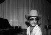 The Best Rock, Pop, and R&B Concerts Coming to Pittsburgh in 2026 Bruno Mars at a piano with a cowboy hat on.