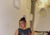 Pittsburgh Restaurant Favorites from Hungry Jess: June 2026 Hungry Jess sits on a grey couch at Esquina Cantina in Pittsburgh in a long dress.