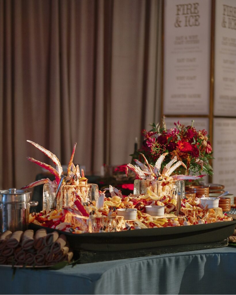 A photo of a seafood display tiered on different levels of ice.