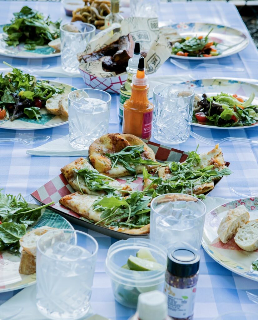 A flatbread pizza with greens on top.