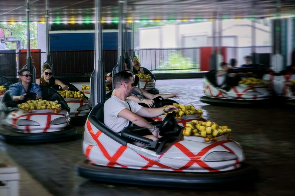 A man drives a bumper car.