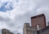 What Was the Impact of the NFL Draft on Pittsburgh One Month Later? Arts Landing in Pittsburgh Downtown with people walking among the grass and tall buildings in the background.