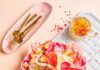 Fresh Strawberry Recipes for Summer Parties, Brunch, and Dinner A bowl full of pink radichio and strawberries with a pink peppercorn vinaigrette in the upper right corner and gold silverware in the left.