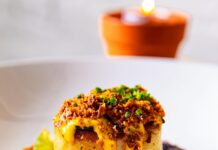 Pittsburgh Vegan Restaurant Week Returns May 11-17 A vegan restaurant week dish featuring a potato stack with vegan melted cheese and other garnishes.