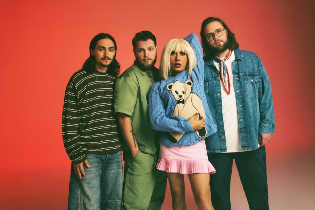 The singer of Rainbow Kitten Surprise with the other three male members of the band.