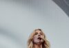 Pittsburgh’s 2026 Summer Concert Lineup Kesha stands in a white bodysuit corset in front of a white screen.