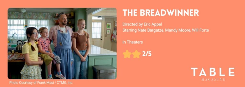 Nate Bargatze stands with his three children in the movie The Breadwinner wearing overalls.