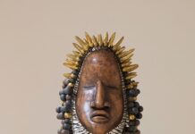 A Summer Full of Art Exhibits in Pittsburgh A bronze statue head with a pointy crown and bulbs for hair.
