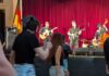 Hot Tickets in Pittsburgh With Sean Collier: July 6-12 People line dancing in Pittsburgh with a live band on the stage.