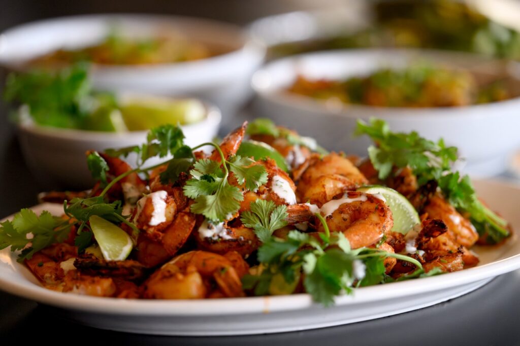 Shrimp with green garnishes.