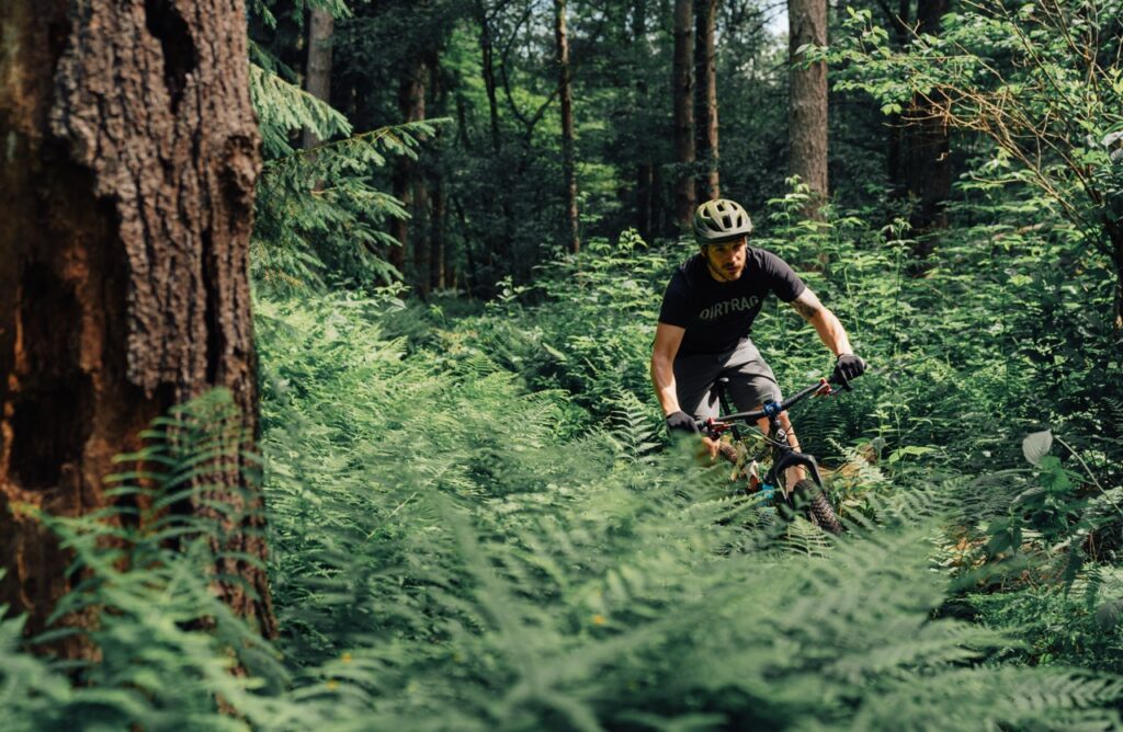 A man bikes through brush in Yellow Creek Forest near Pittsburgh.
