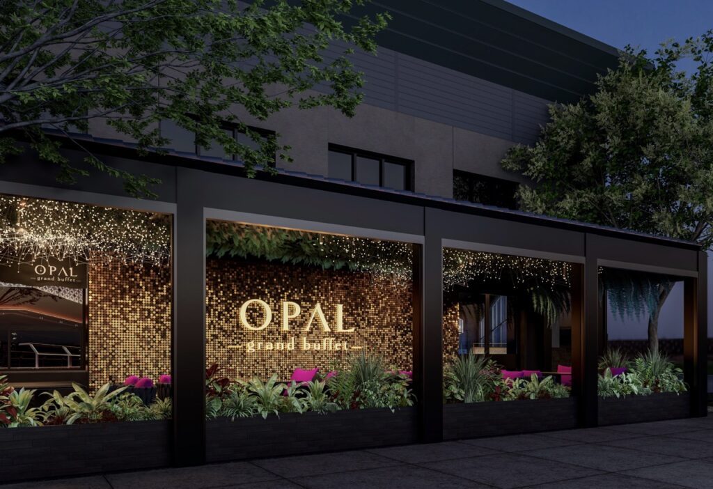 The outside of Opal Buffet with greenery all around the windows.