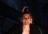 Standout Pittsburgh Theater Shows to Put on Your 2026 Calendar A person in a corset and black jacket crouched down on stage.