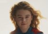 Collier’s Cuts: Hi, I’m ‘Supergirl,’ Welcome to ‘Jackass: Best and Last,’ Hitting Movie Theaters Supergirl stands in her costume with her hair blowing back and the sun glowing around her.