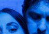 Pittsburgh’s Independent Theater Scene Is Thriving With ‘Danny and the Deep Blue Sea’ Up close faces of a man and a woman, the woman looking at the camera and the man looking down in blue lighting.