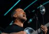 Dave Matthews Band at The Pavilion at Star Lake: What to Know Before You Go Dave Matthews plays an acoustic guitar and sings into a mic on stage.