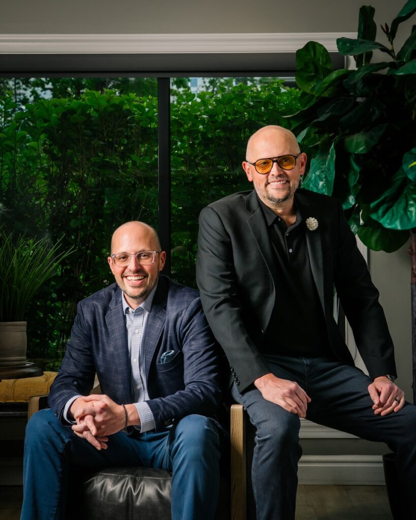 Drs. Brian and Rob Klaich sit on chairs at Cranberry Dental Studio.