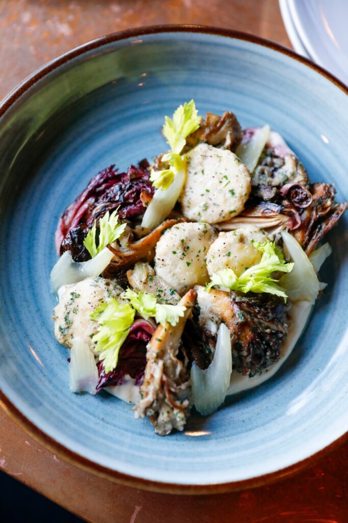 A blue plate of a seafood salad.