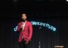 Hot Tickets in Pittsburgh With Sean Collier: July 27-August 2 Jay Pharoah on stage at a comedy club in a red jacket with a mic in his hand.