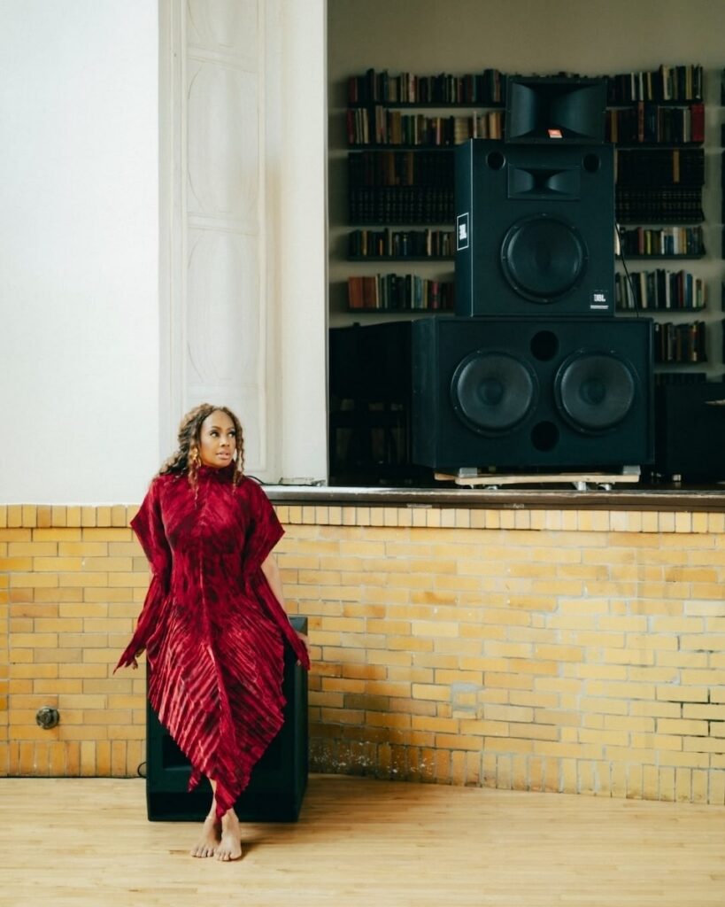 Woman in red dress by speakers, Pittsburgh events this weekend