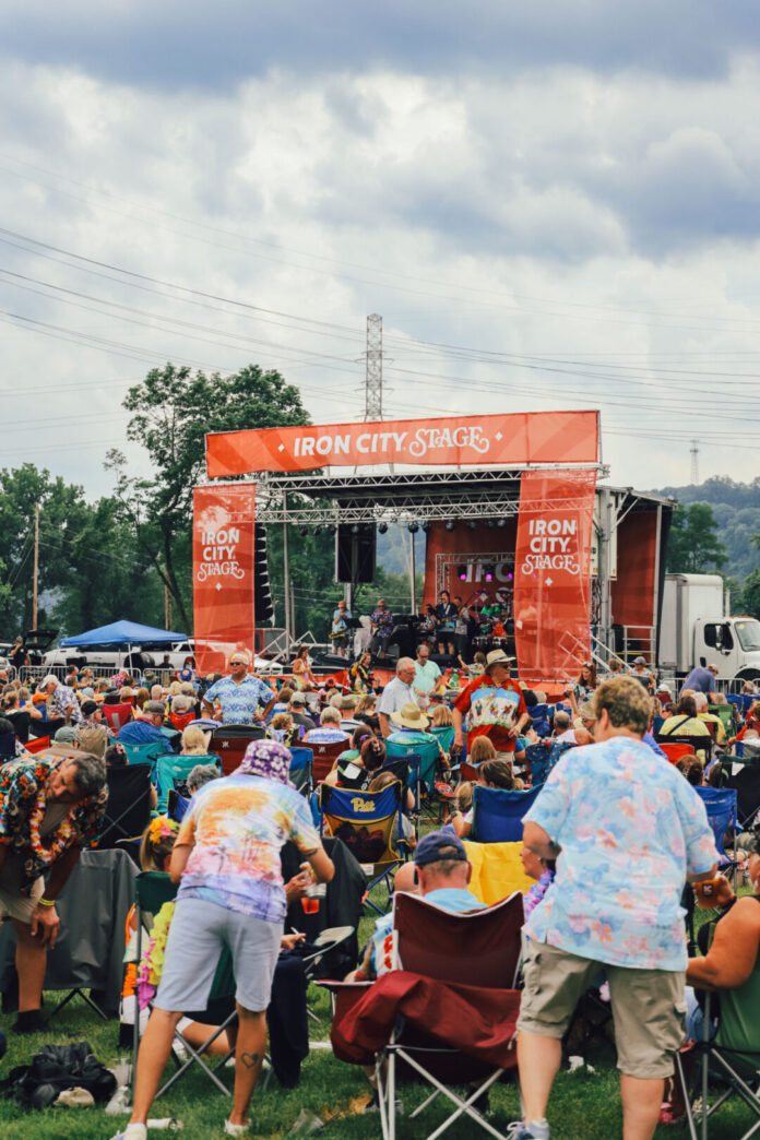Pittsburgh Events: Your Guide to August 10-16 People sit out in front of the iron city stage at Pittsburgh brewing company.