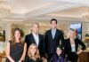 Louis Anthony Jewelers Combines Family Tradition With Fine Jewelry: Head of the Table, July 2026 The Louis Anthony Jewelers family sit together in the showspace all in black elegant clothing.