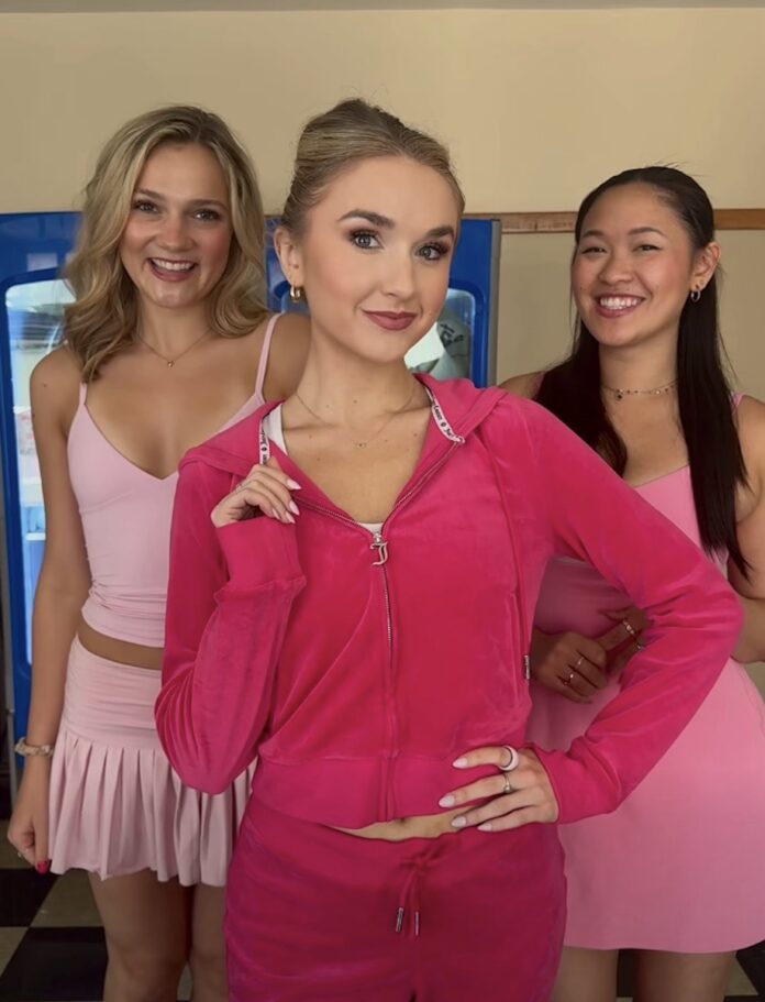 Get in Loser, We're Seeing 'Mean Girls' by Pittsburgh CLO Three girls in pink clothing stand together smiling as the three plastics in Mean Girls.