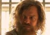Collier’s Cuts: ‘Motor City’ Is an Action Movie with No Words — and ‘The Dink’ Is a Streaming Comedy with Genuine Laughs A man with long hair and a beard and muscles stands in a white muscle tee.