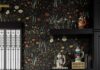 How to Add Character to a New Construction Home with NW Design Studio A black and wildflower wall paper over a white marble table with black shelves on the wall.