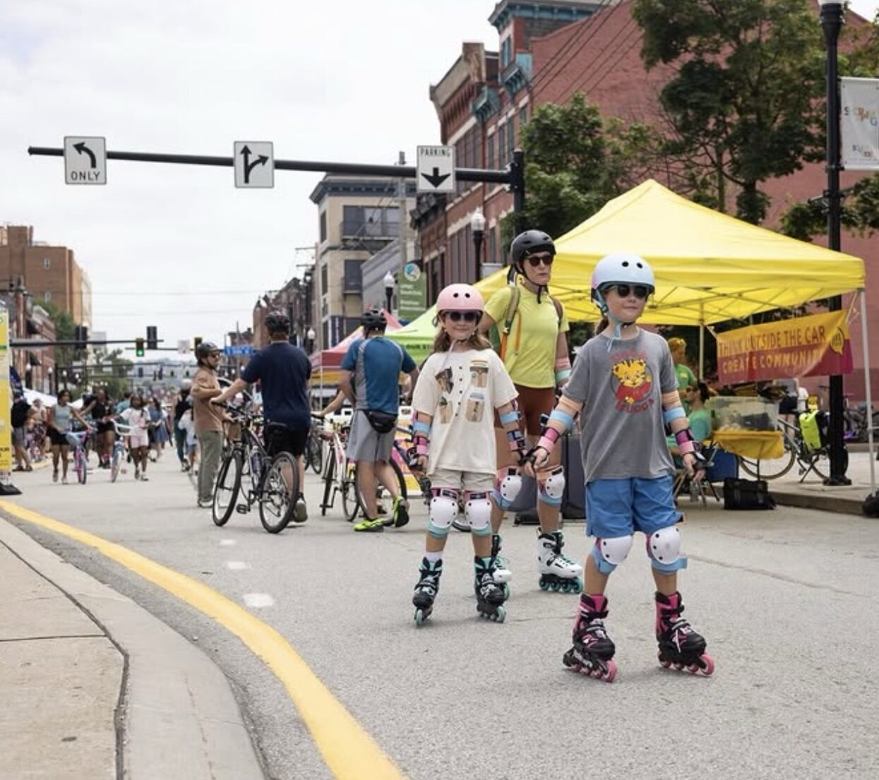 Kids roller skating down the street in Pittsburgh.