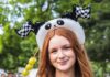 Panda Fest Highlights Asian Cuisine, Art, and Culture in Its First Pittsburgh Appearance A girl in a panda headband holding Tanghulu in her hand.