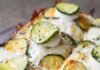 Where to Get Pickle Foods and Drinks in Pittsburgh If You’re Skipping Picklesburgh A pickle pizza with slices of pickles, white cheese, and white sauce from Iron Born in Pittsburgh.