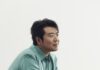 Pittsburgh Classical Concerts to See This Fall (August-September 2026) Lang Lang in a blue button up shirt leaning over a black piano.
