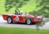How to Do the Pittsburgh Vintage Grand Prix 2026—Even If You Don’t Know a Thing About Cars A vintage car with red paint and a white number spot with a racer in the seat.