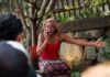 RealTime Arts’ Equitable Dinners series Offers a Show, Dinner and Conversation An actress outside yells on the phone as an audience watches.