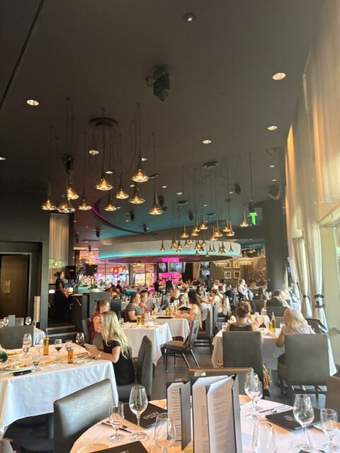 People sitting at tables in a dining area at Rivers Casino in Pittsburgh