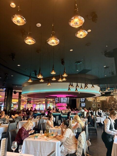 Sip and Social at Rivers Casino Pittsburgh People sitting at dining tables in a restaurant at Rivers Casino in Pittsburgh
