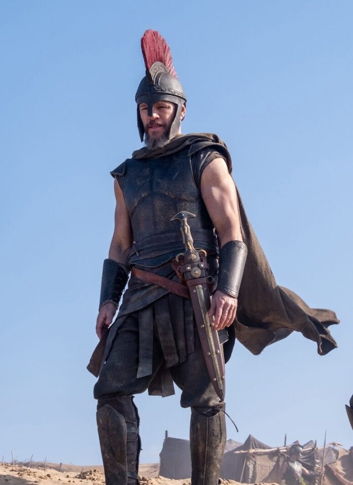 The Odyssey Summer Blockbusters 2026 TABLE Magazine Matt Damon stands on a sandy mountain in battle gear in The Odyssey.