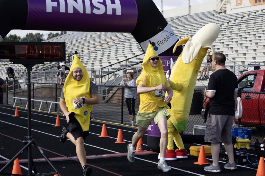 People in banana costumes running a race.
