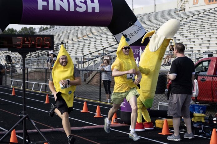People in banana costumes running a race.
