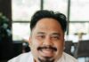 Spirits & Tales Welcomes Andrew Alvarez as New Executive Chef Chef Andrew Alvarez sits in a white shirt, smiling.