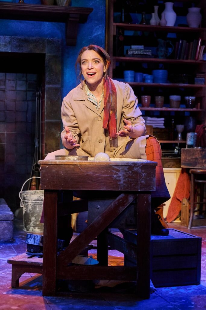 Woman on stage at Pittsburgh event, acting in a play